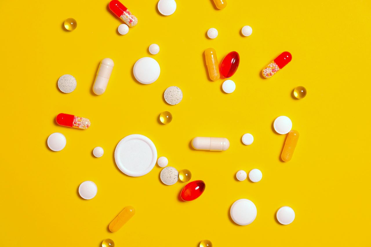 Packet of contraceptive pills on a calendar – symbol for stopping the pill