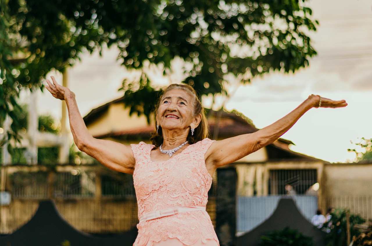 Mature woman in the morning sun – symbolizing a new life phase